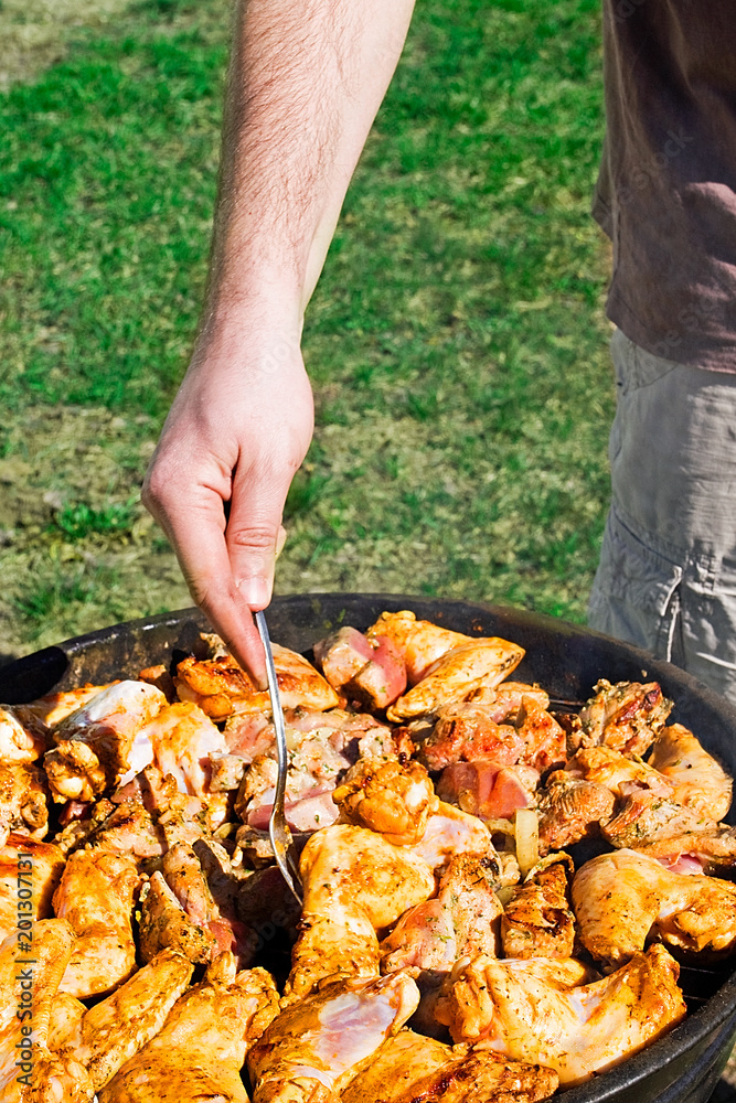 cook chicken wings on the grill on the grass cook chicken wings on the grill on the grass