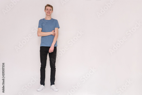 young man on a white background in different poses showing different emotions
