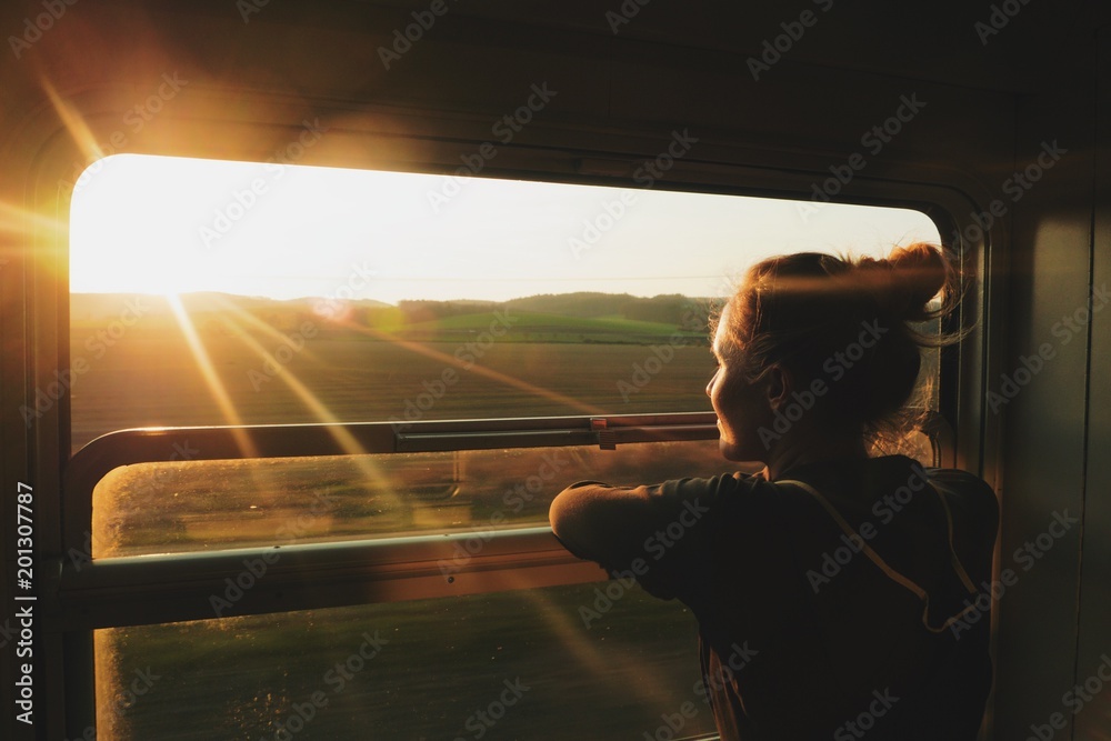 caucasian woman traveling by train - obrazy, fototapety, plakaty 