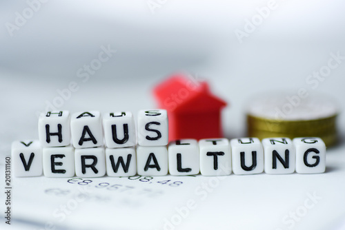 German Word Property management formed by alphabet blocks: HAUSVERWALTUNG photo