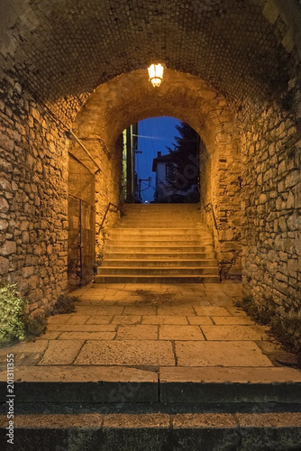 Arch entrance with stone walls to the old city of  Ioannina at night  Greece