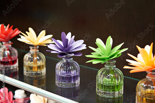 Flowers in jars with fragrant oils