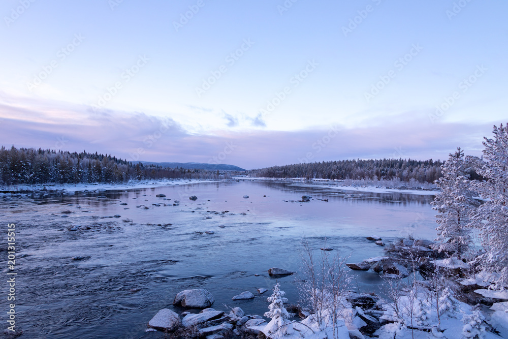 Scenic winter sunset over a river