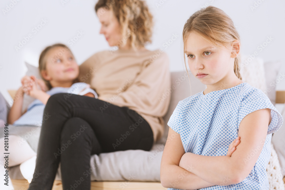 Upset girl with arms crossed