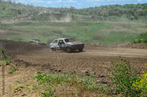 Race of the old wrecked cars. Rally on the open air with dust
