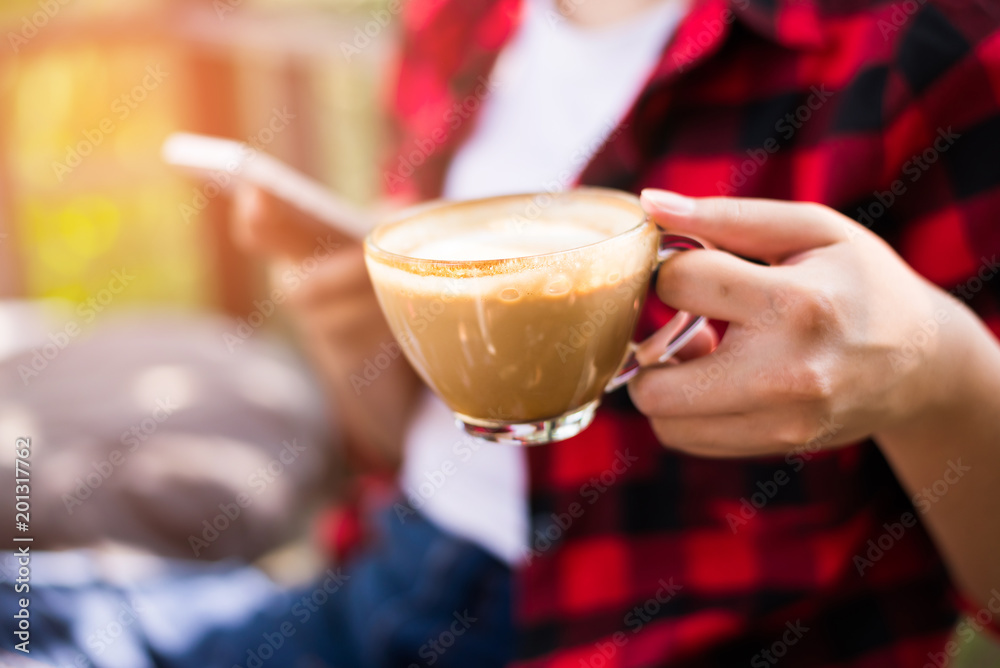 Closeup of female hands holding coffee Closeup of female hands holding coffee