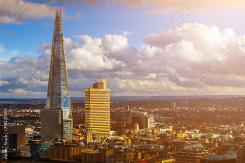 London, England - Aerial view of the Shard, London's highest skyscraper at sunset with nice clouds and blue sky