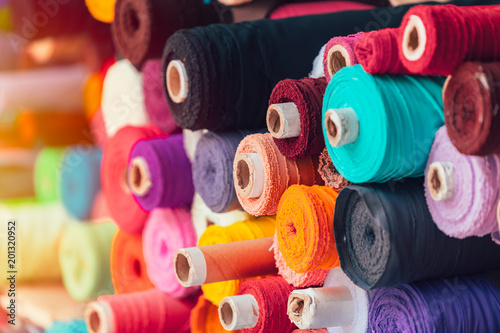 colorsful fabric silk rolls in textile shop industry from india photo