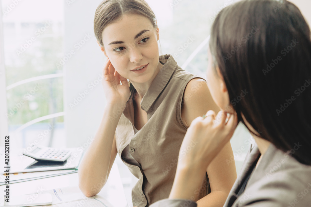 Two Businesswoman team worker co-working together mix race in the office Two Businesswoman team worker co-working together mix race in the office