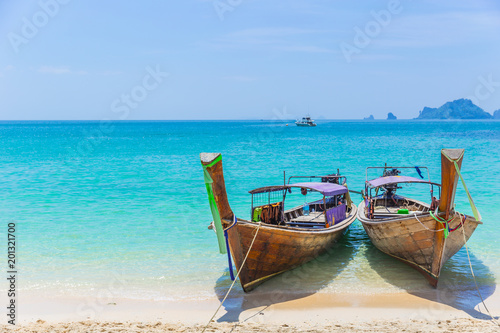 Thailand Andaman Sea Travel with Long tail boats on Tropical beach Summer Holiday © Quality Stock Arts