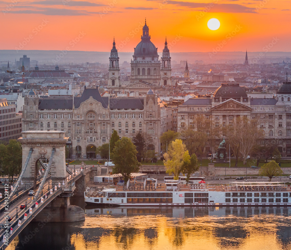 Budapest, Hungary - Beautiful Chain Bridge at sunrise with St. Stephen's Basilica. Spring has arrived in Budapest