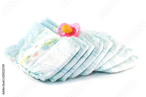 .Baby diapers and a pacifier on a white background, isolate photo