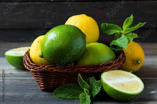 Fresh citrus and mint in a wooden basket photo