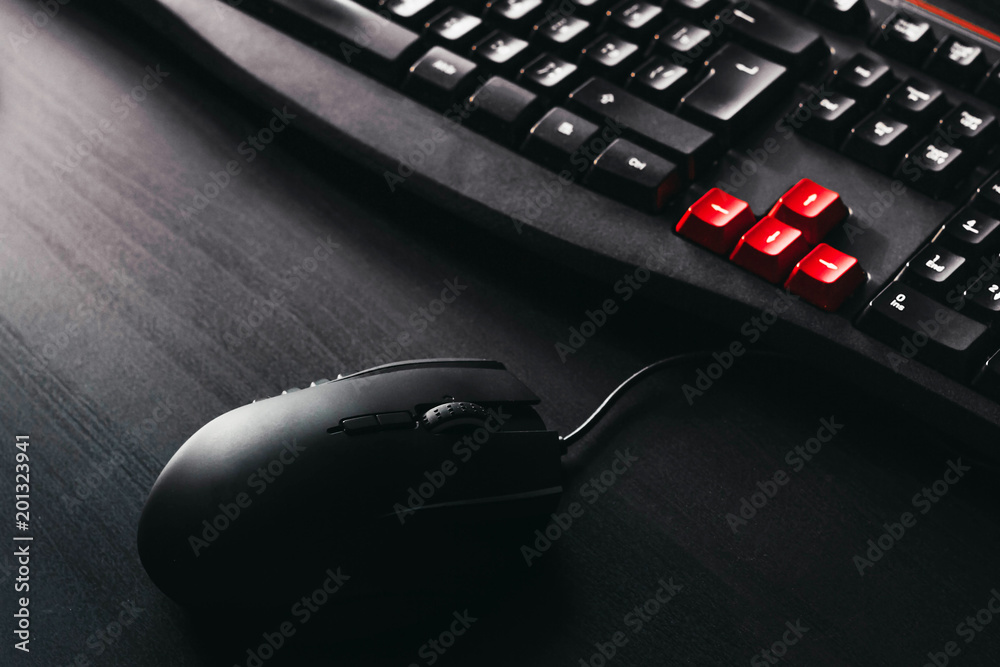 gaming keyboard and mouse on black table gaming keyboard and mouse on black table