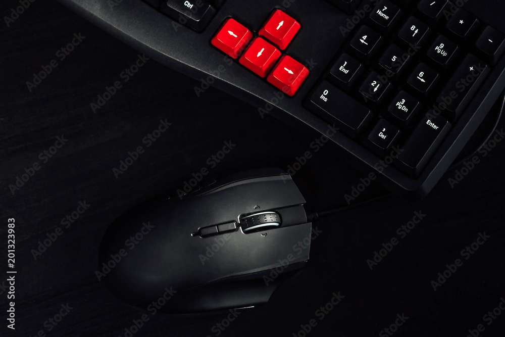 gaming keyboard and mouse on black table