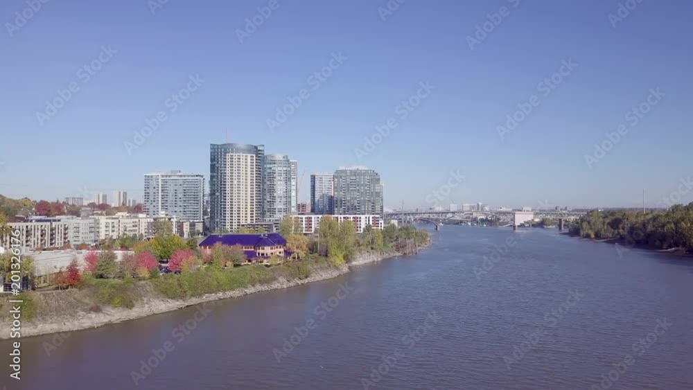Aerial View Of Highrise Condos In Portland, Drone Flys Over Willamette River, Ross Island On Right, Oregon, USA Aerial View Of Highrise Condos In Portland, Drone Flys Over Willamette River, Ross Island On Right, Oregon, USA