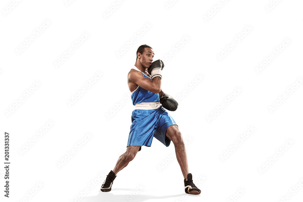 Sporty man during boxing exercise making hit. Photo of boxer on white background