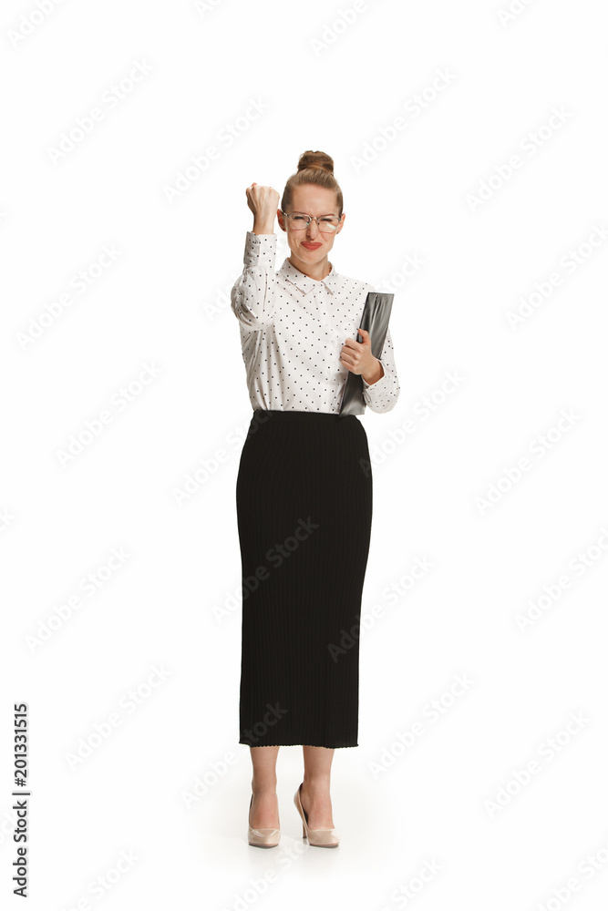 Full length portrait of a smiling female teacher holding a folder isolated against white background Full length portrait of a smiling female teacher holding a folder isolated against white background