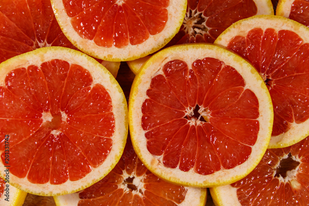 Fresh slices of grapefruits as background Fresh slices of grapefruits as background