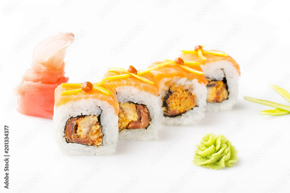 Exquisite sushi rolls with tuna and tobiko sauce. Isolated. Sushi roll on a white background. Exquisite sushi rolls with tuna and tobiko sauce. Isolated. Sushi roll on a white background.