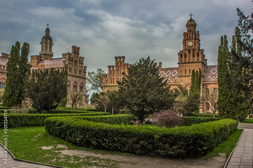 Fototapeta premium old university campus yard with garden 