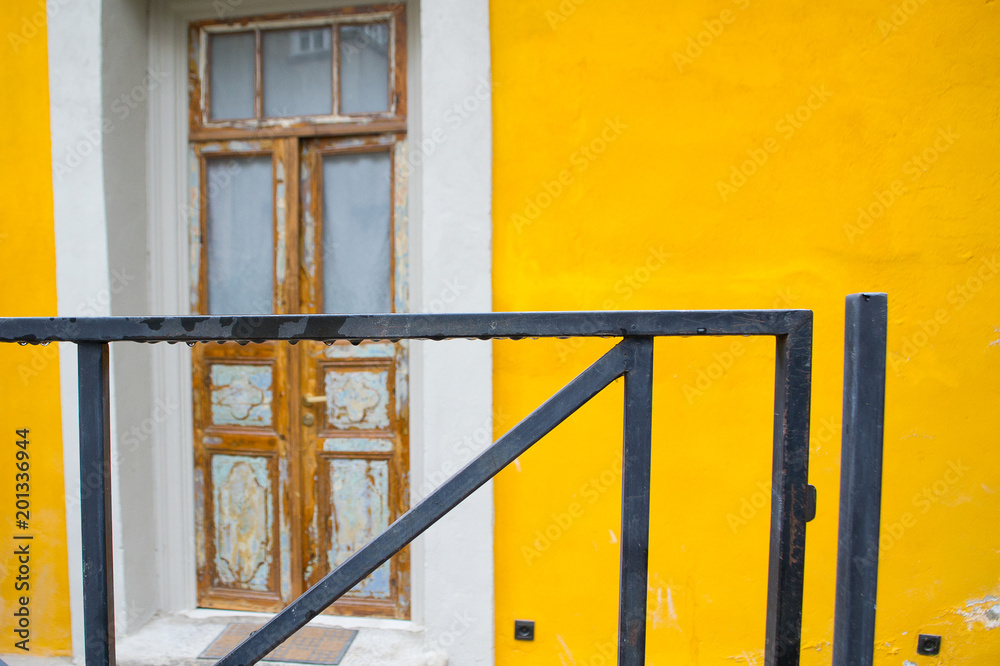 view of an old door in a yellow building. Georgia, Tbilisi view of an old door in a yellow building. Georgia, Tbilisi