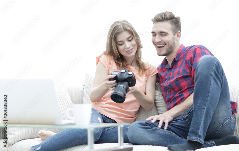 happy young couple checks photos on photos the camera happy young couple checks photos on photos the camera