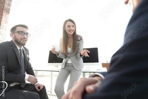 blurred image of business team during a break.