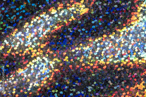 Abstract macro holographic background, trendy colorful backdrop in shiny confetti dots for creative design web and print