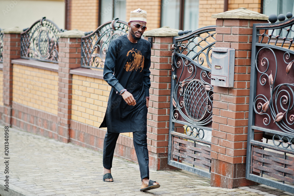 custom made wallpaper toronto digitalRich african man in stylish traditional clothes and hat posed outdoor background his mansion.