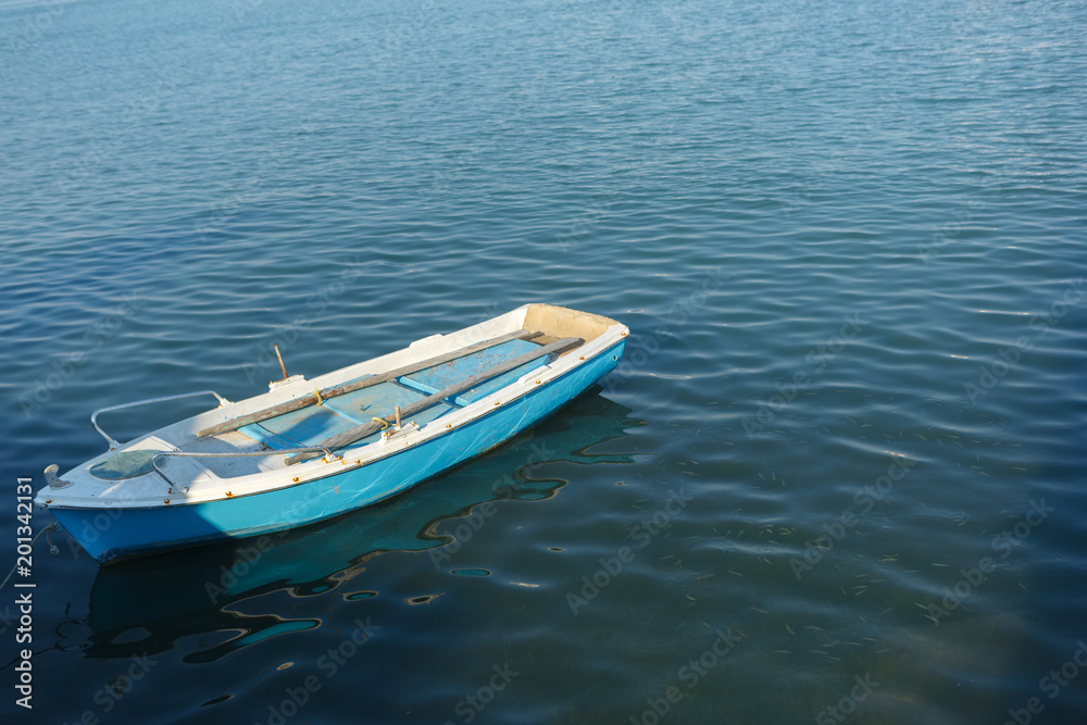 Fishing boat bobs on the waves