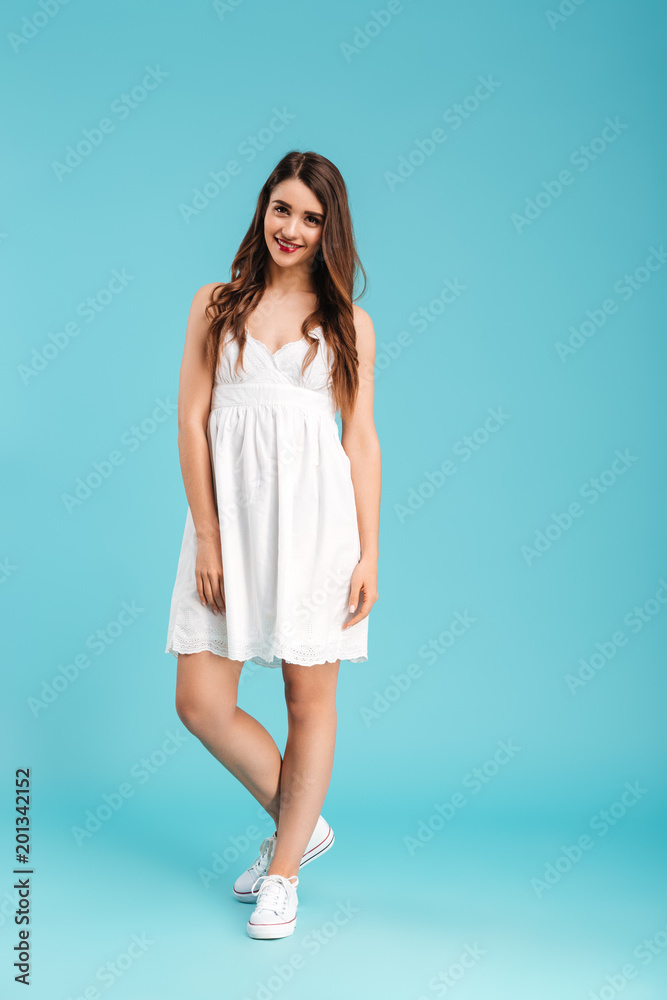 Full length portrait of a smiling young girl in summer dress Full length portrait of a smiling young girl in summer dress