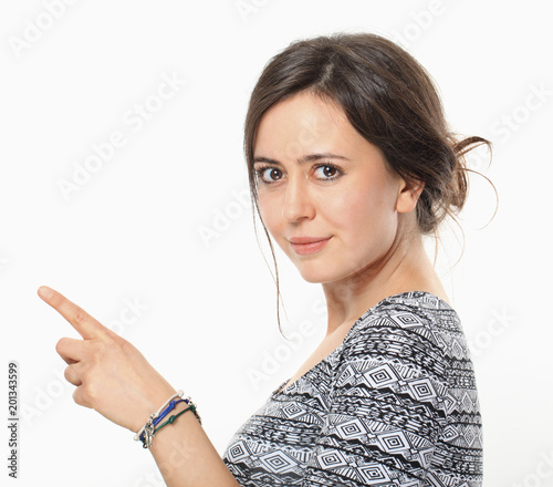 Wonderful woman pointing her forfinger to the right photo