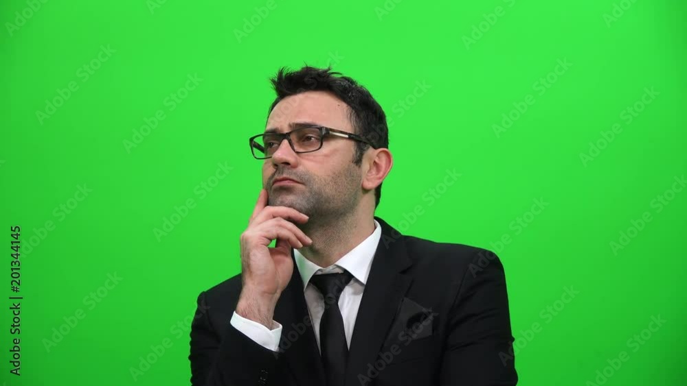 Serious Man Looking Up on Green Screen Background Serious Man Looking Up on Green Screen Background