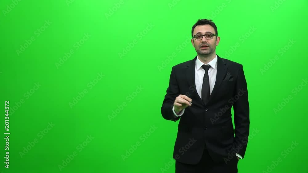 Businessman Presenting in Front of a Green Screen. Right Side. Businessman Presenting in Front of a Green Screen. Right Side.