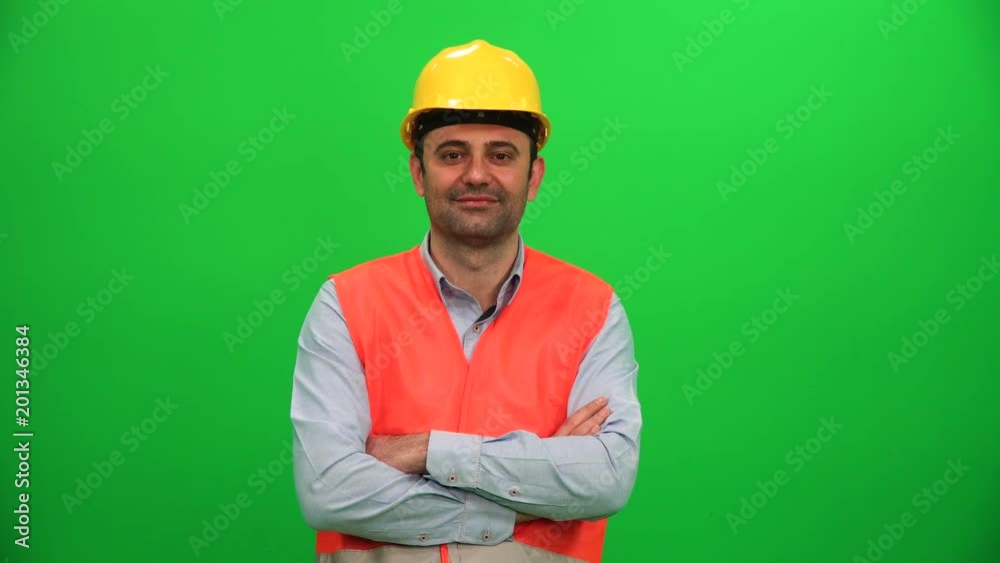 Engineer or Construction Worker Looking on Green Background