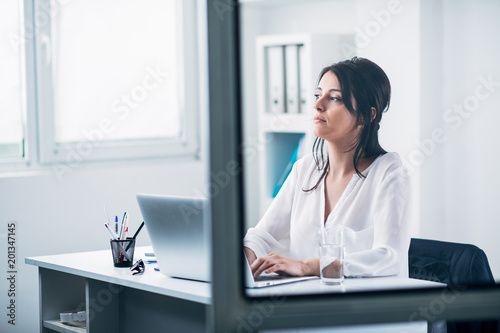 Young woman in office