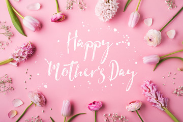 Happy mothers day composition. Flowers on white background. Studio shot.