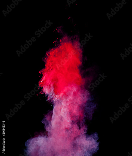 Abstract colored powder explosion isolated on black background.