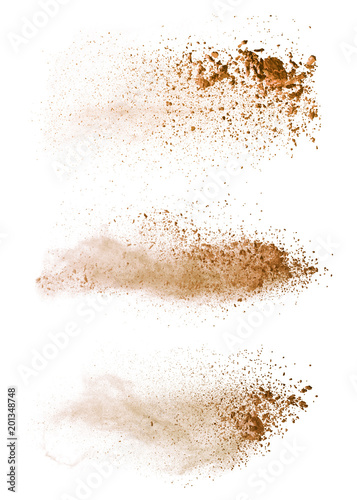 Abstract colored brown powder explosion isolated on white background.