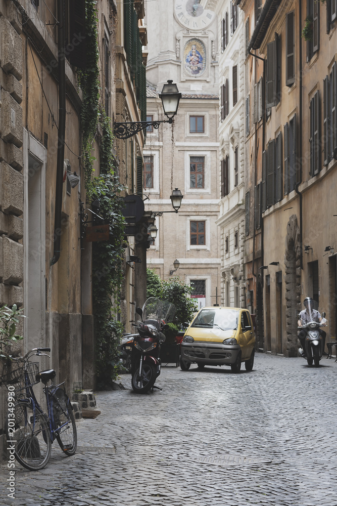 Fototapeta Different transport on the street of Rome
