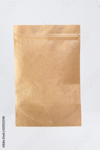 Craft paper pouch bag front view isolated on white background.