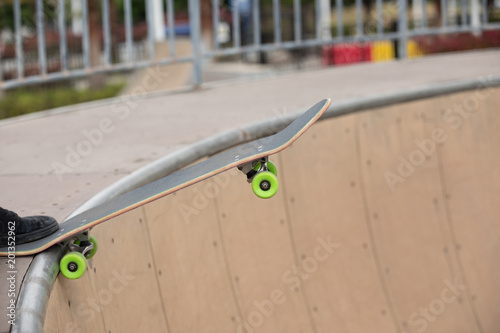 Skateboarder on skatepark ramp