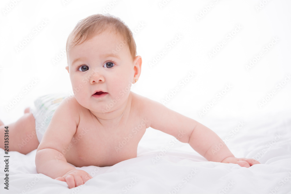 Adorable little baby girl smiling on white background
Adorable little baby girl smiling on white background