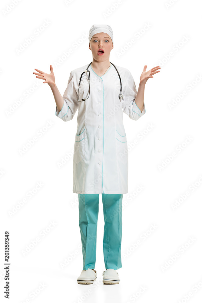Beautiful young woman in white coat posing at studio. Full length studio shot isolated on white. Beautiful young woman in white coat posing at studio. Full length studio shot isolated on white.