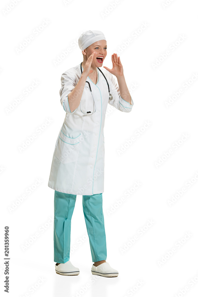 Beautiful young woman in white coat posing at studio. Full length studio shot isolated on white. Beautiful young woman in white coat posing at studio. Full length studio shot isolated on white.
