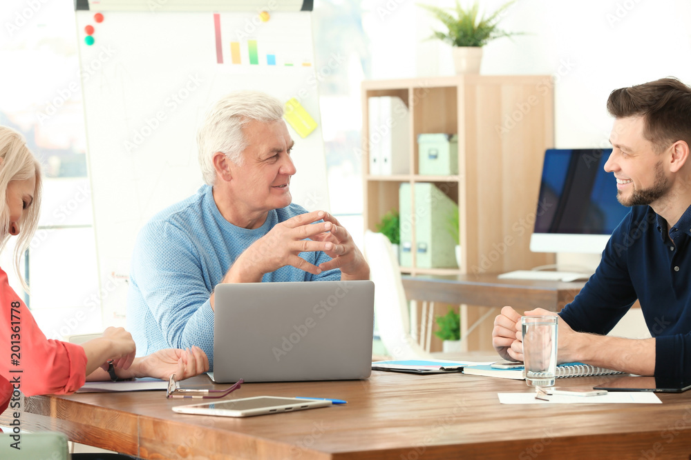 Group of people discussing ideas at table in office. Consulting service concept Group of people discussing ideas at table in office. Consulting service concept