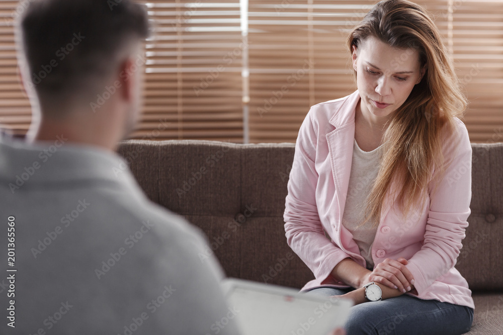Depressed woman talking with advisor Depressed woman talking with advisor