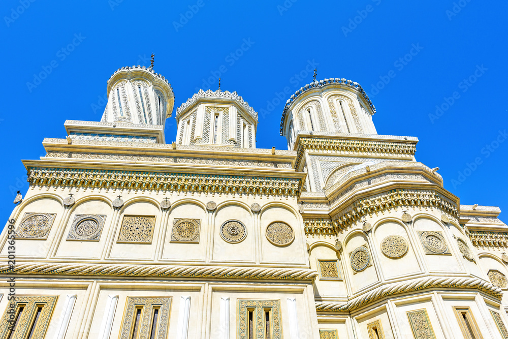 Daylight closeup view to monastery facade and domes