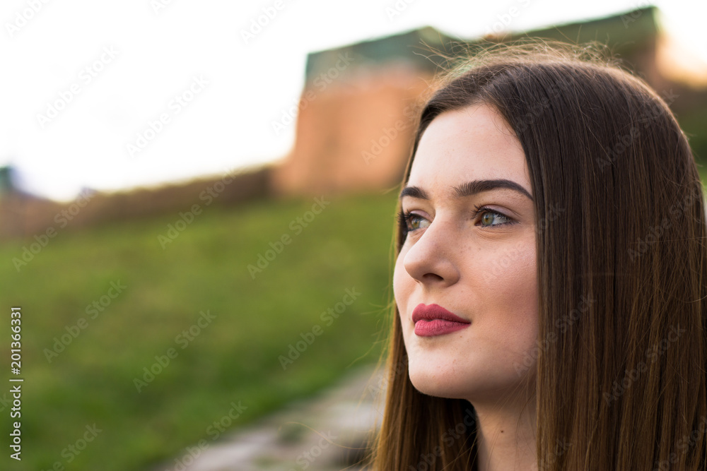 Fototapeta premium Young girl portrait in city in spring